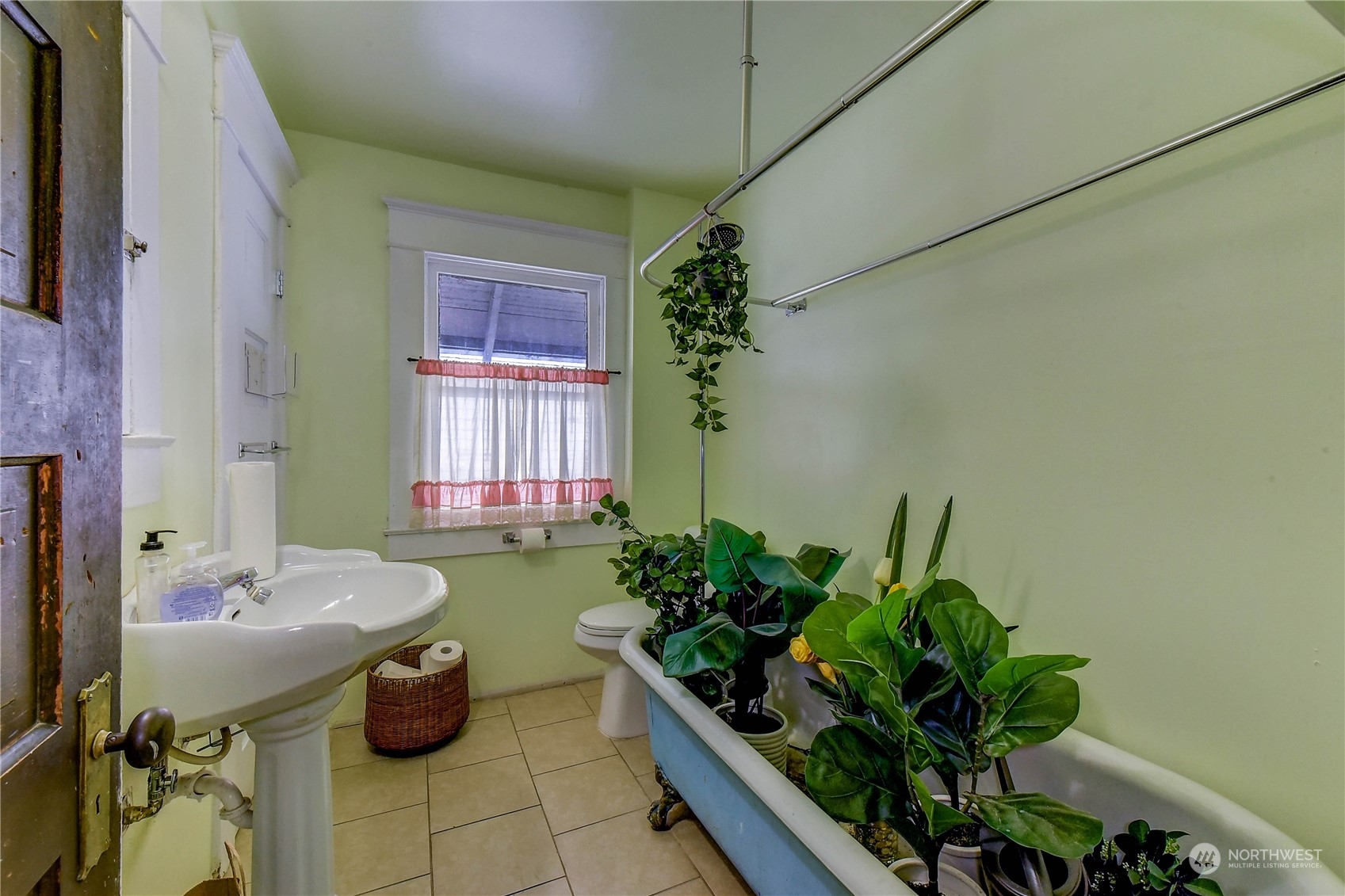 911 24th Avenue Seattle, WA 98122 - Photo 11 of 20 a living room with furniture and a potted plant