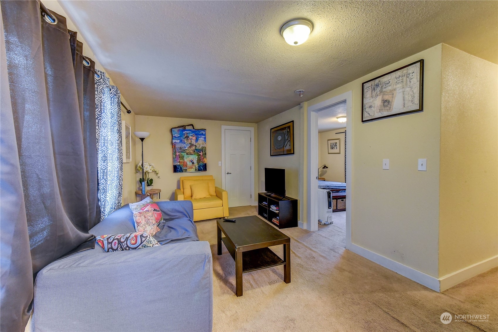 911 24th Avenue Seattle, WA 98122 - Photo 19 of 20 a living room with furniture and a flat screen tv