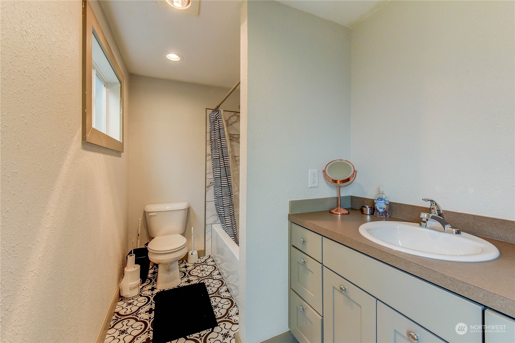 911 24th Avenue Seattle, WA 98122 - Photo 20 of 20 a bathroom with a sink toilet and mirror