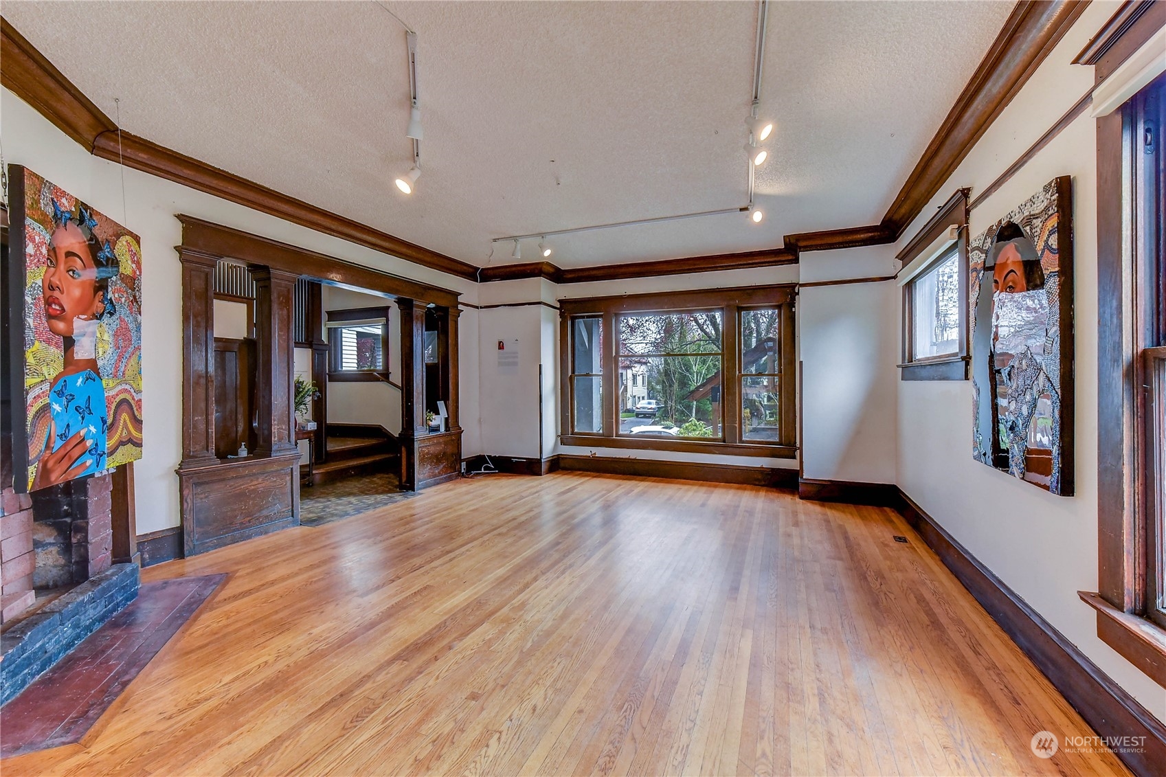 911 24th Avenue Seattle, WA 98122 - Photo 5 of 20 wooden floor in an empty room with a window