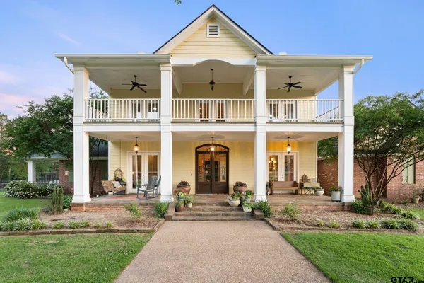 front view of a house with a garden