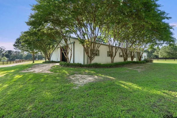a view of a house with a big yard