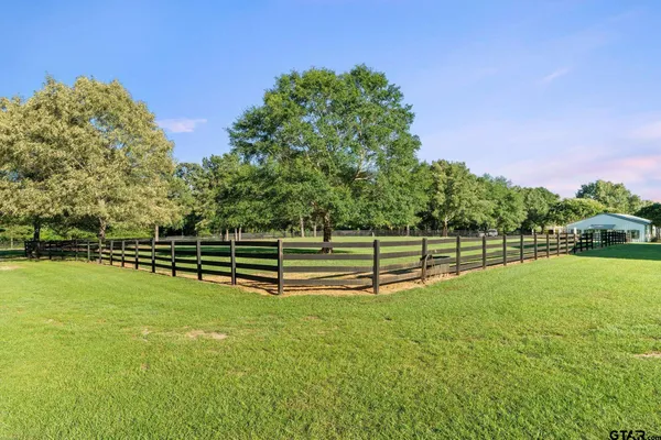 a view of a house with a big yard