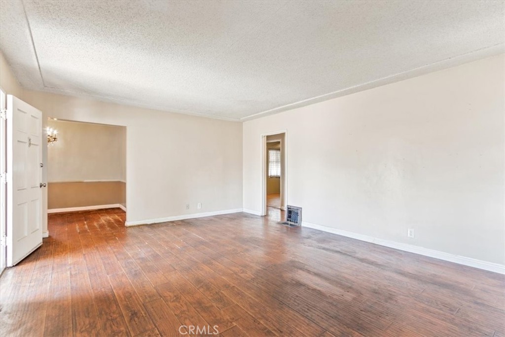 5929 Norwalk Boulevard Whittier, CA 90606 - Photo 13 of 33 a view of an empty room with wooden floor