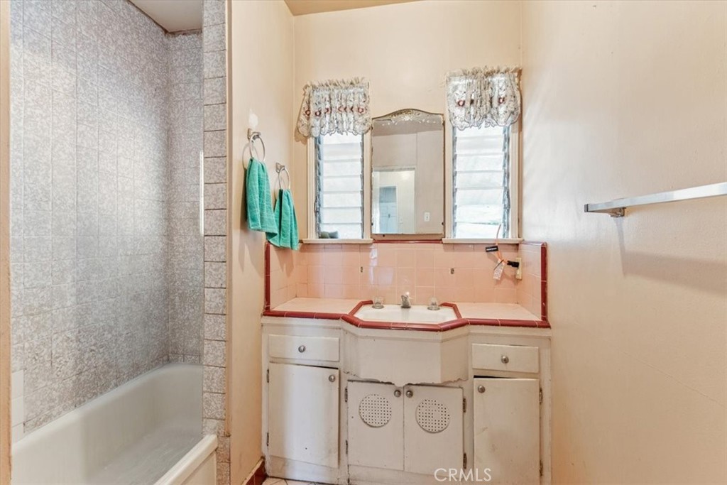 5929 Norwalk Boulevard Whittier, CA 90606 - Photo 18 of 33 a bathroom with a sink and a mirror