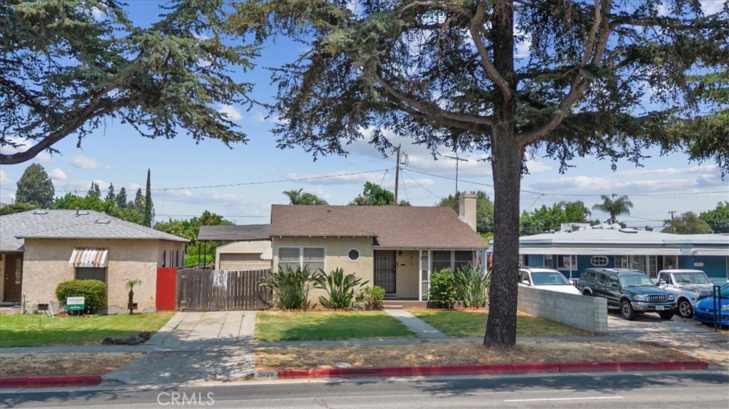 5929 Norwalk Boulevard Whittier, CA 90606 - Photo 2 of 33 a front view of a house with garden