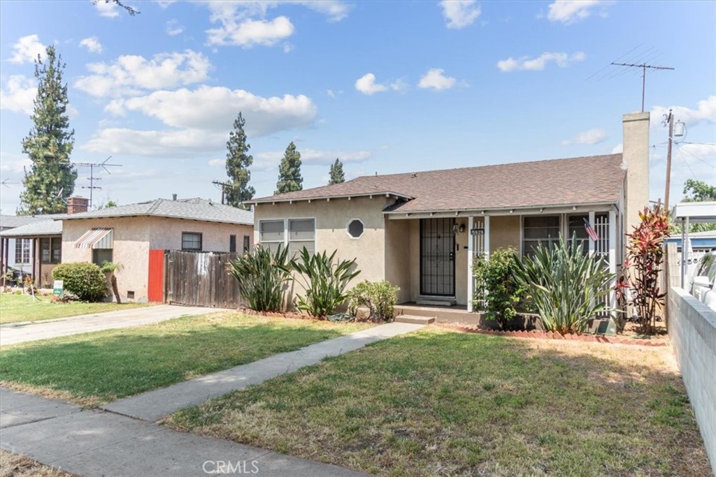 5929 Norwalk Boulevard Whittier, CA 90606 - Photo 5 of 33 a front view of a house with a yard and potted plants