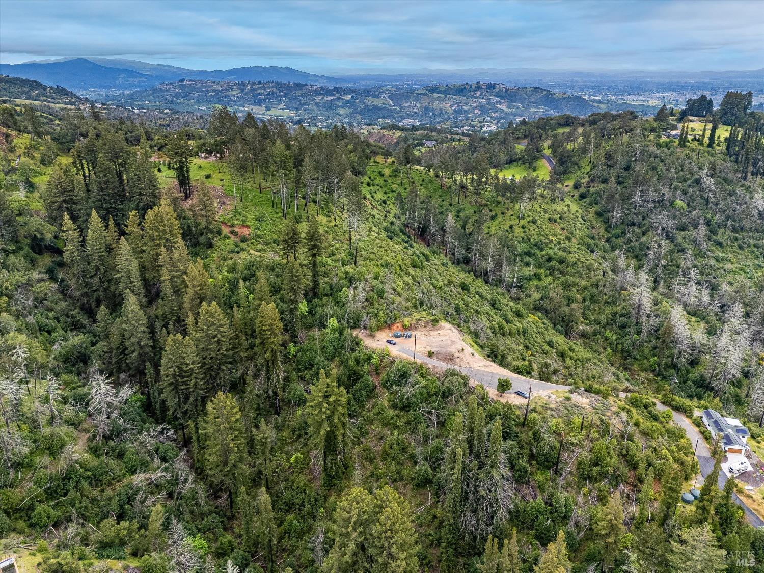 2272 Mark West Springs Road Santa Rosa, CA 95404 - Photo 16 of 29 a view of a city with lush green forest
