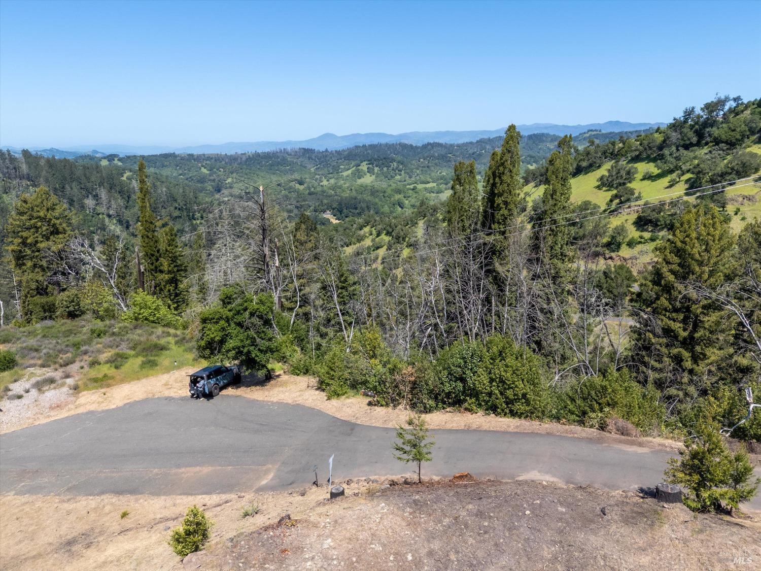 2272 Mark West Springs Road Santa Rosa, CA 95404 - Photo 22 of 29 a view of a road with a yard