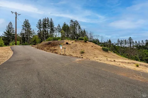 a view of a road with a building in the background