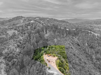 a view of a yard with a mountain