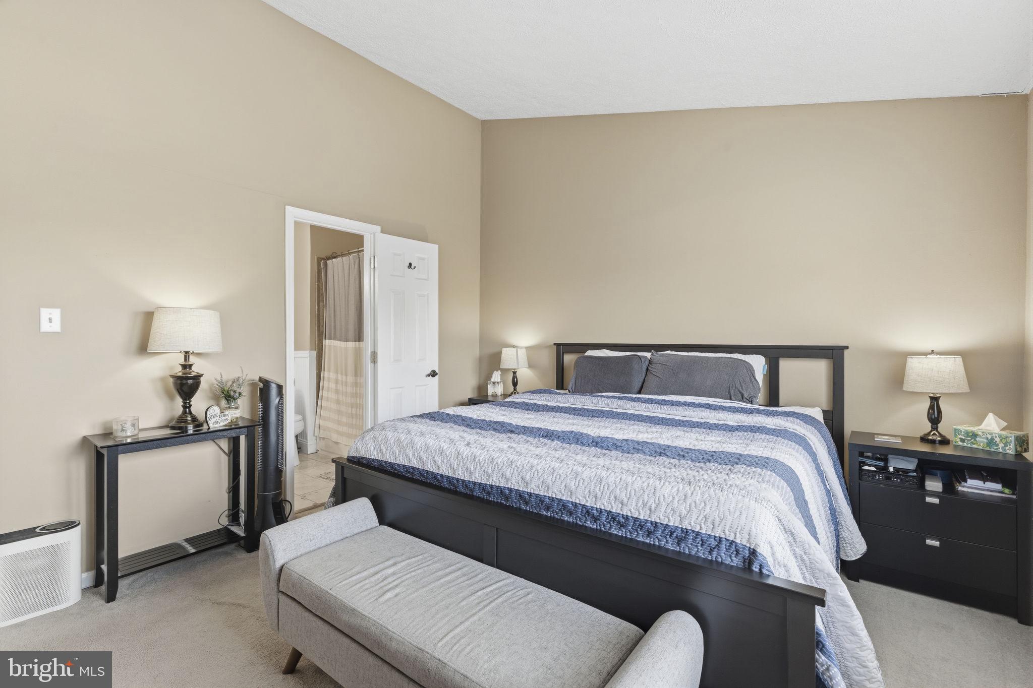 853 Comer Square Bel Air, MD 21014 - Photo 13 of 35 a bedroom with a bed and a lamp