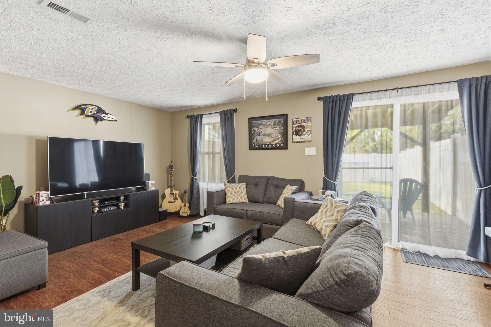 853 Comer Square Bel Air, MD 21014 - Photo 22 of 35 a living room with furniture and a flat screen tv