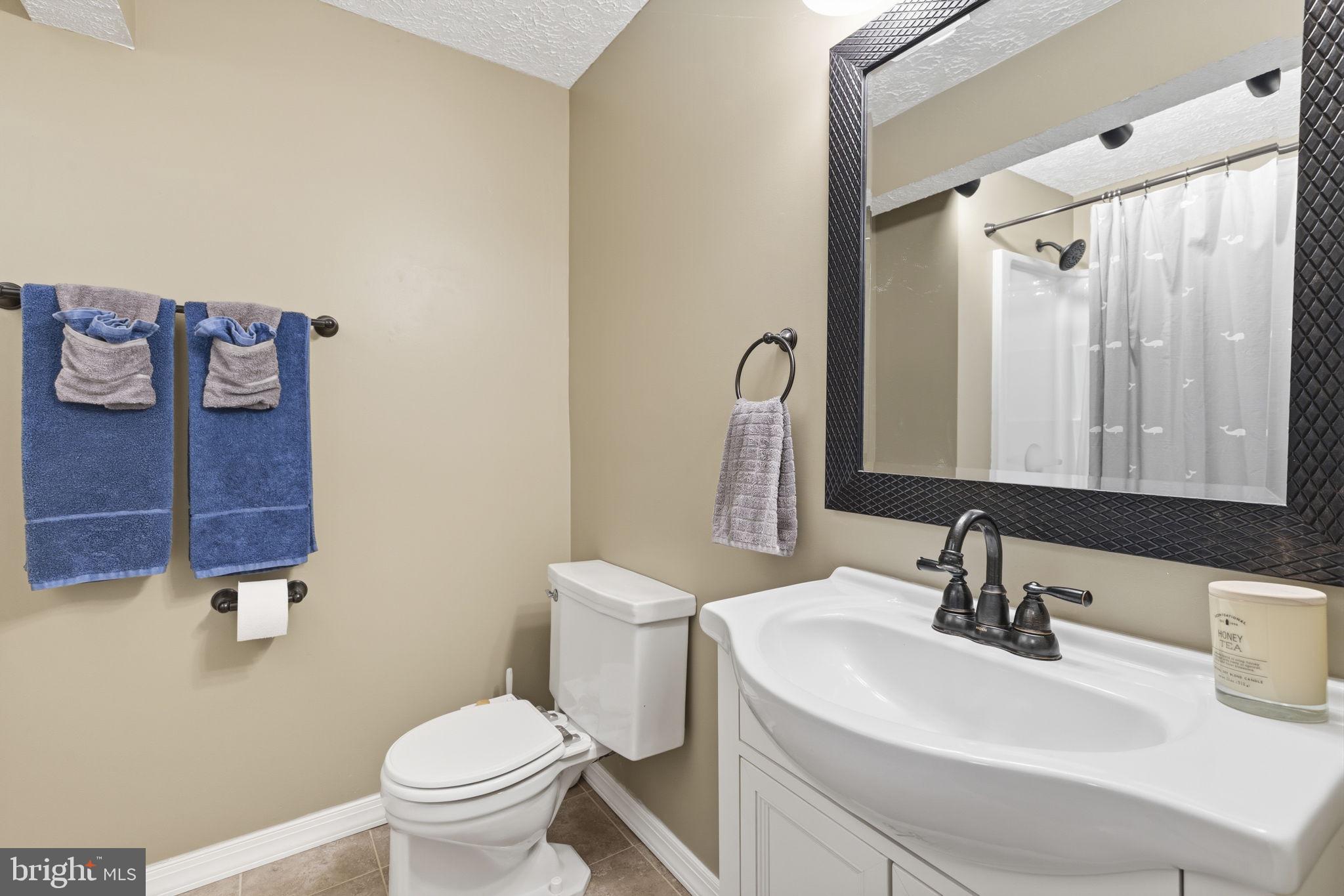 853 Comer Square Bel Air, MD 21014 - Photo 24 of 35 a bathroom with a sink a toilet and mirror