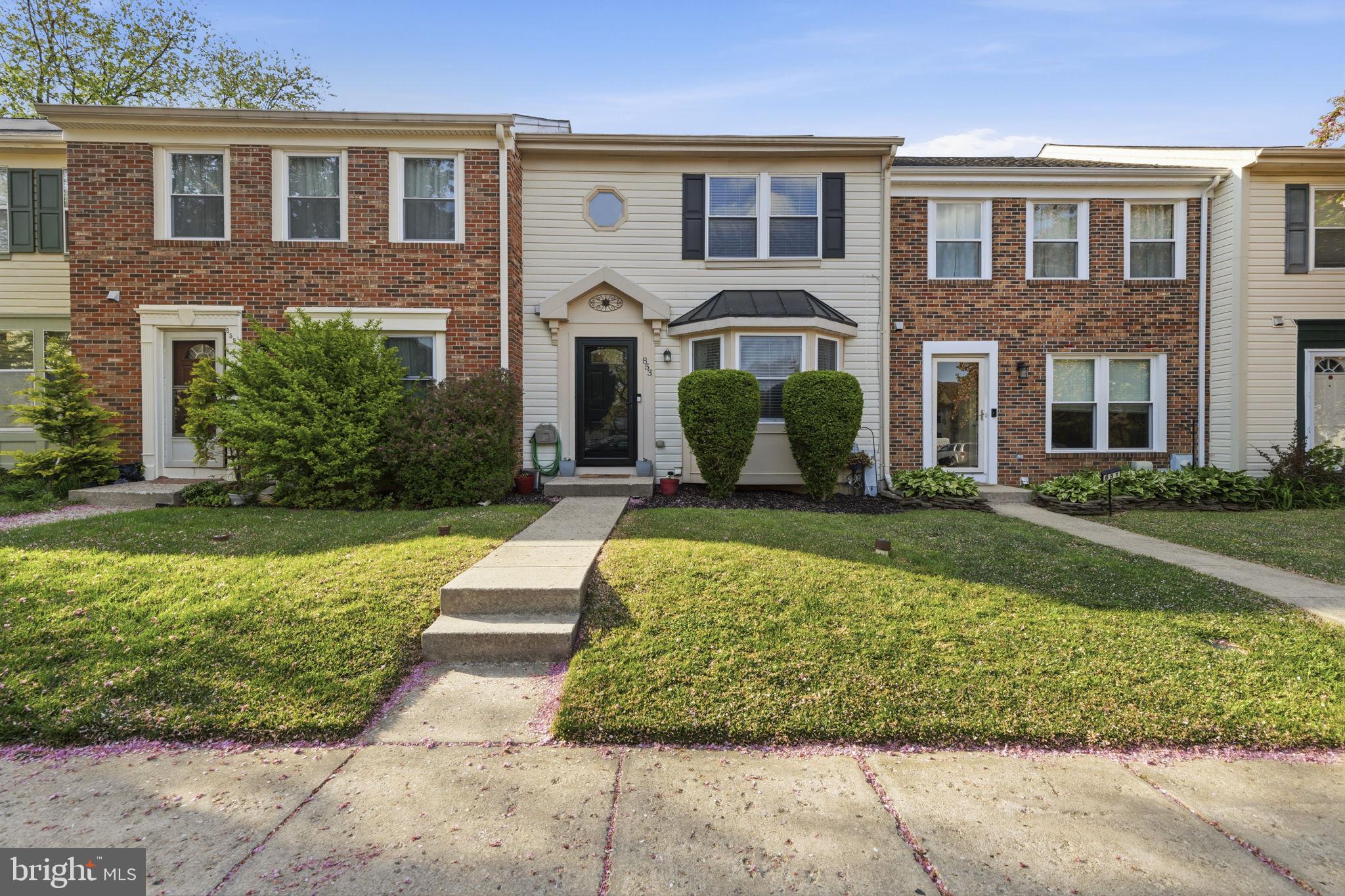 853 Comer Square Bel Air, MD 21014 - Photo 29 of 35 front view of a brick house with a yard