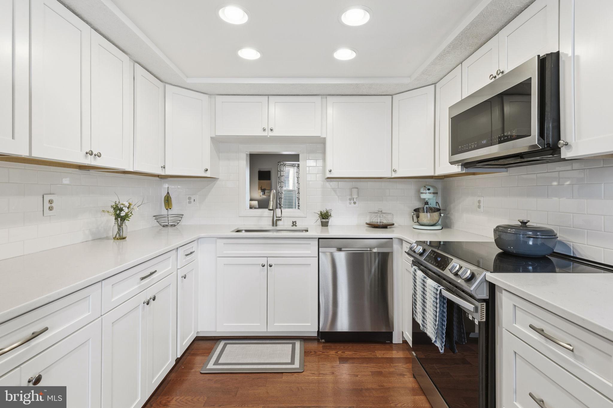 853 Comer Square Bel Air, MD 21014 - Photo 5 of 35 a kitchen with cabinets stainless steel appliances a sink and a microwave