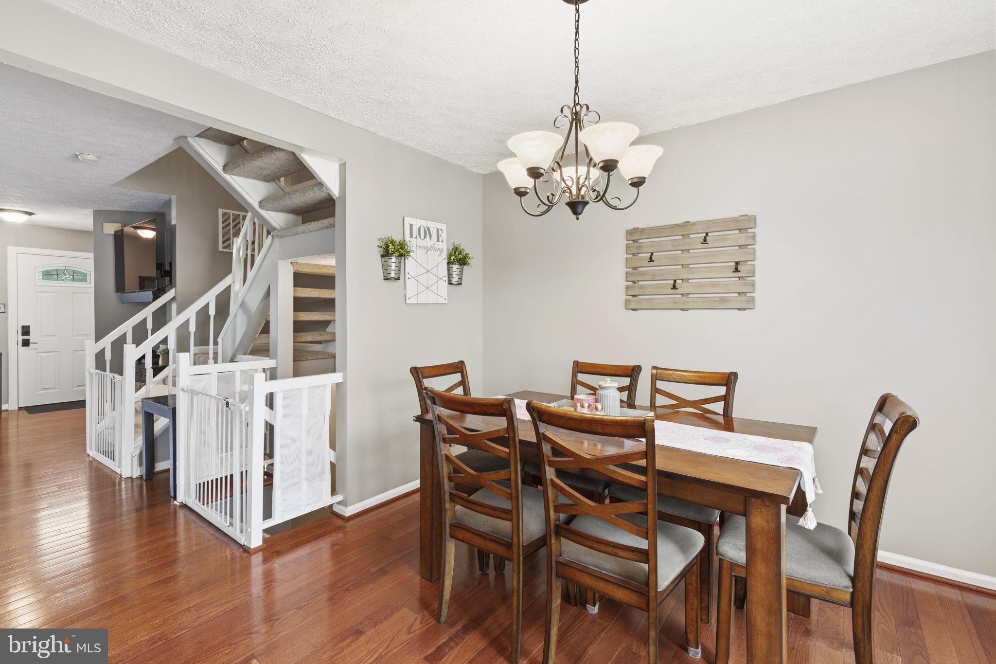 853 Comer Square Bel Air, MD 21014 - Photo 8 of 35 a view of a dining room with furniture wooden floor and chandelier