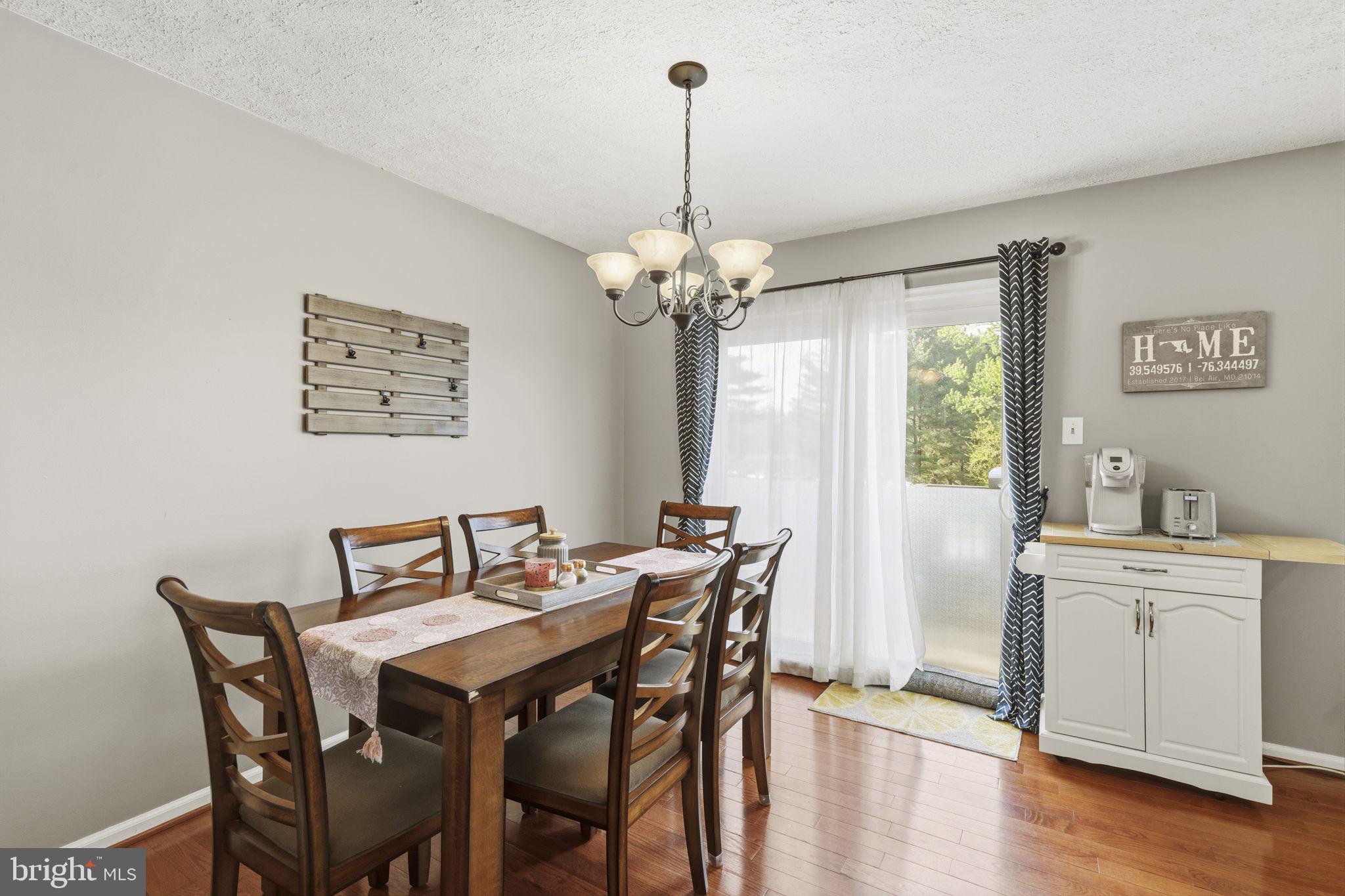 853 Comer Square Bel Air, MD 21014 - Photo 9 of 35 a view of a dining room with furniture window and wooden floor