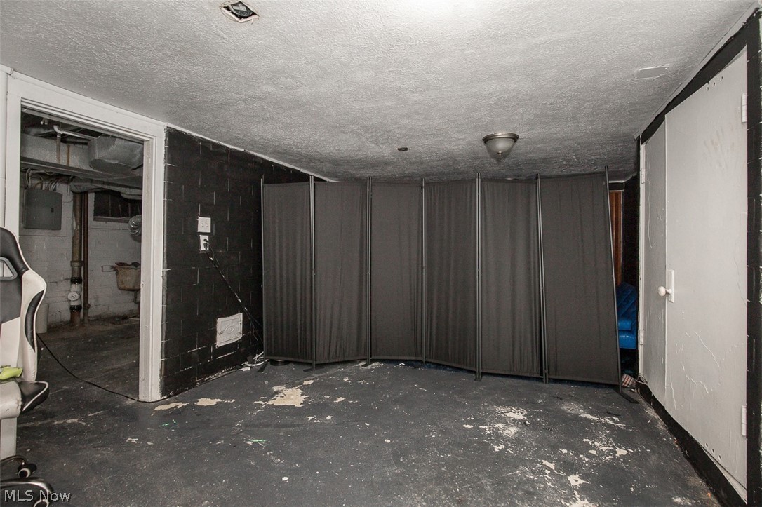 982 Roanoke Road Cleveland Heights, OH 44121 - Photo 30 of 33 Basement space with painted concrete block walls.