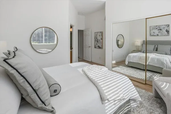 a bedroom with a bed and a couch