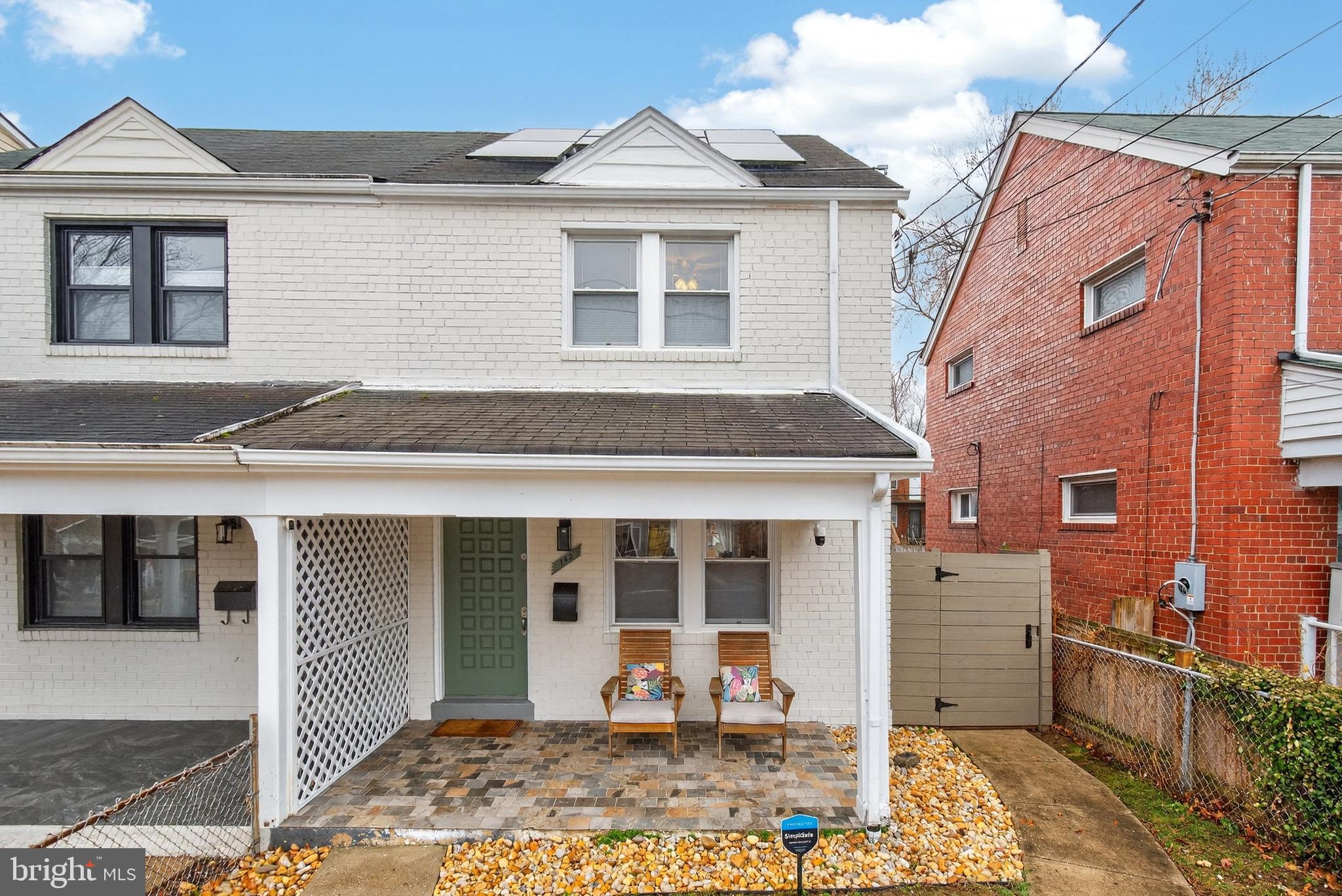 162 Forrester Street Southwest Washington, DC 20032 - Photo 1 of 28 a front view of a house with a yard