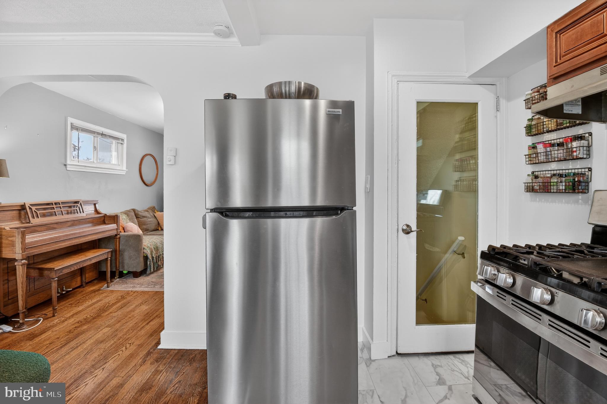 162 Forrester Street Southwest Washington, DC 20032 - Photo 11 of 28 a kitchen with stainless steel appliances granite countertop a refrigerator and a stove top oven