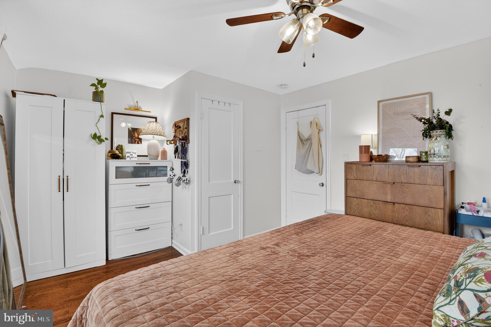 162 Forrester Street Southwest Washington, DC 20032 - Photo 14 of 28 a bedroom with a bed and a chandelier