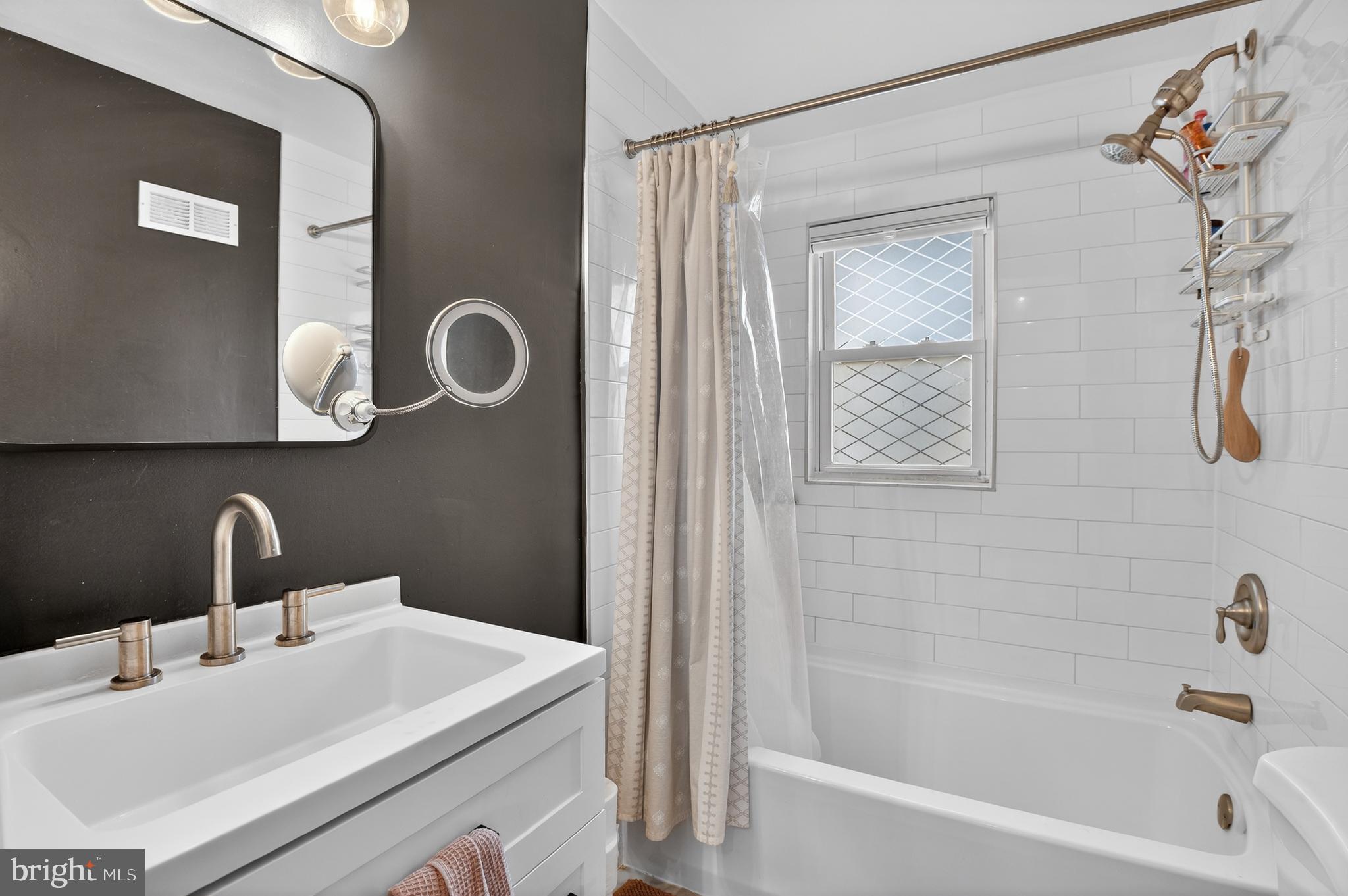 162 Forrester Street Southwest Washington, DC 20032 - Photo 16 of 28 a bathroom with a sink and a mirror