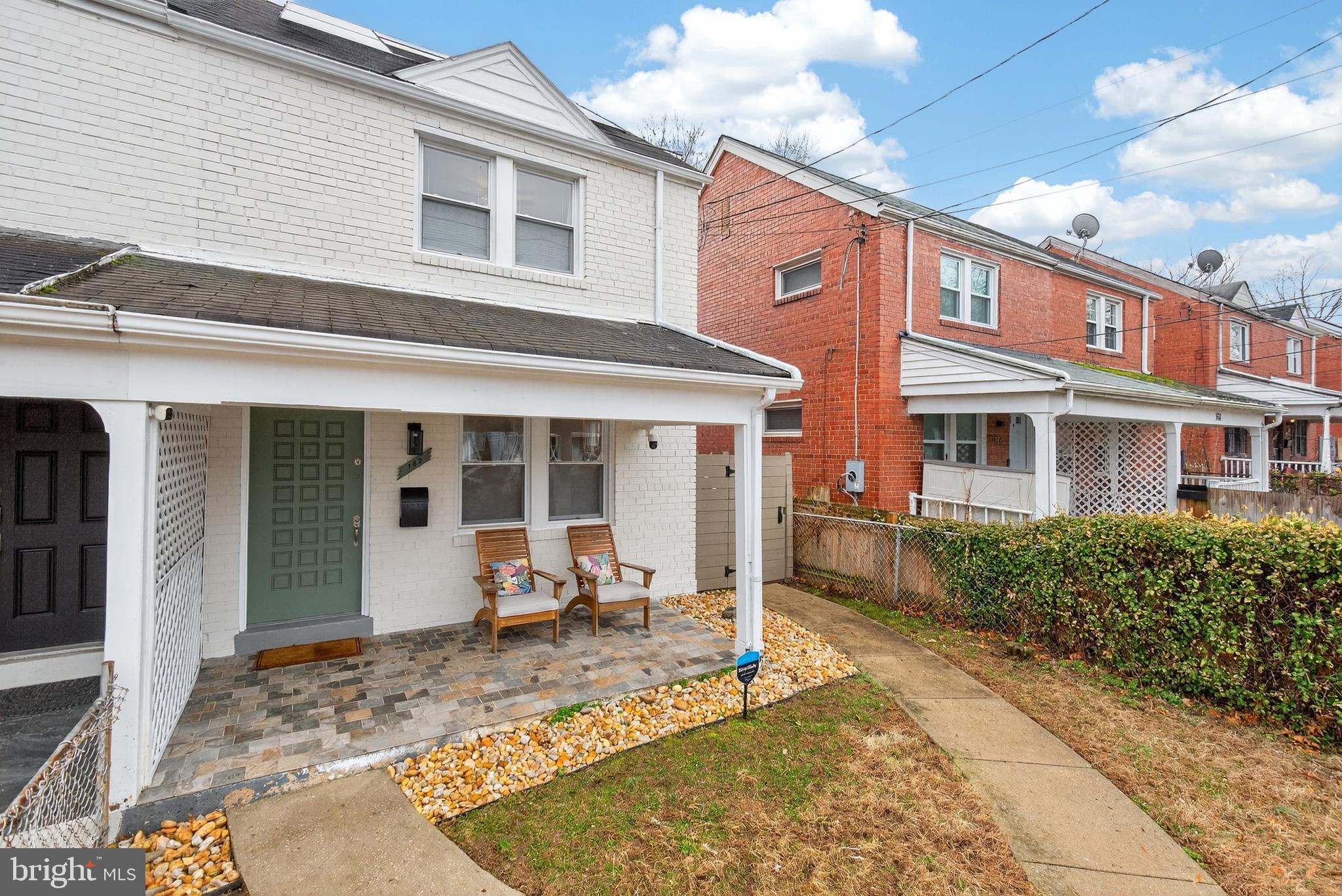 162 Forrester Street Southwest Washington, DC 20032 - Photo 2 of 28 a front view of a house with garden