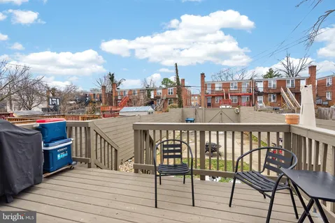 a view of a chairs on the roof deck