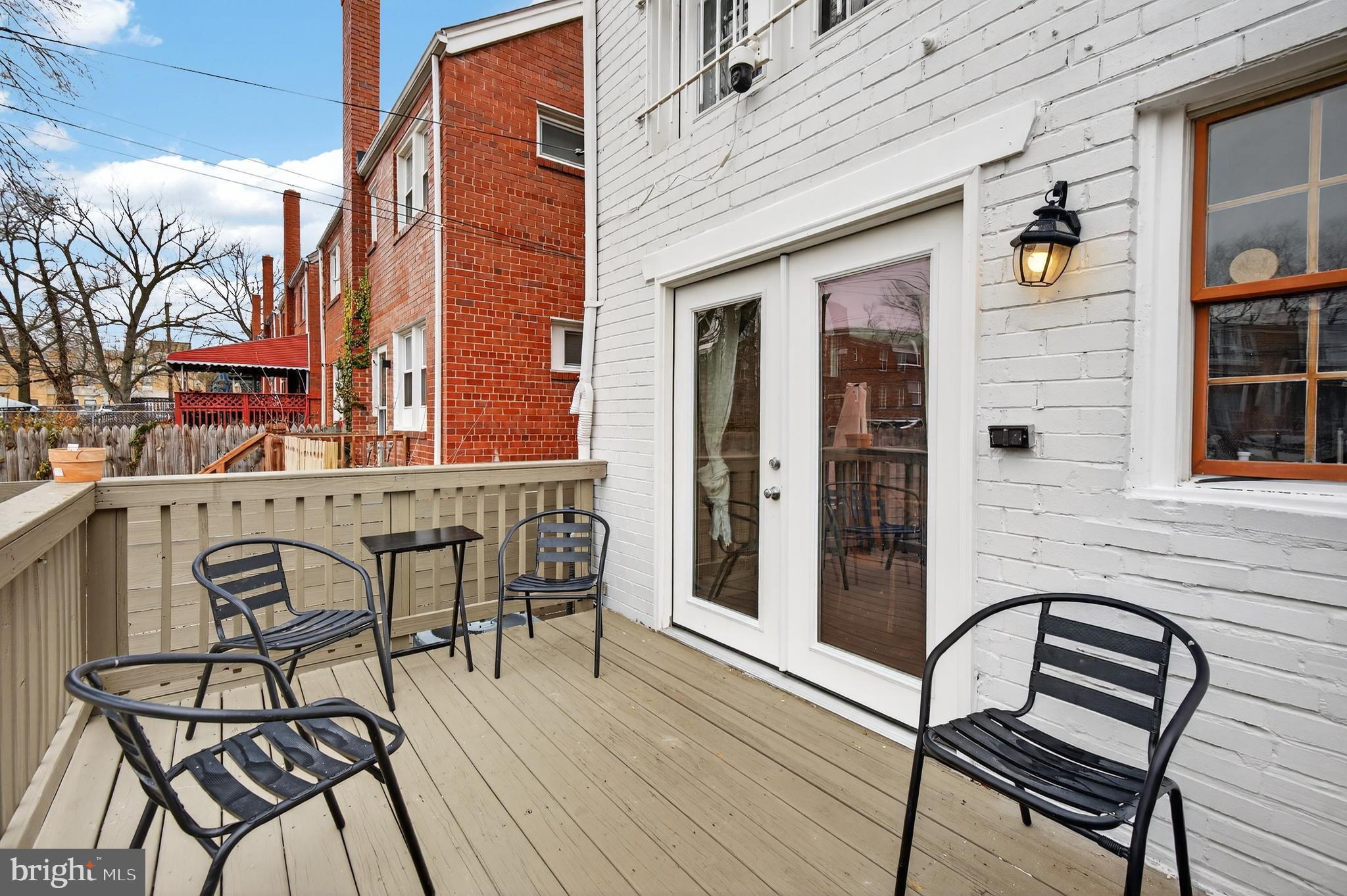162 Forrester Street Southwest Washington, DC 20032 - Photo 26 of 28 a view of a brick house with table and chairs and wooden floor