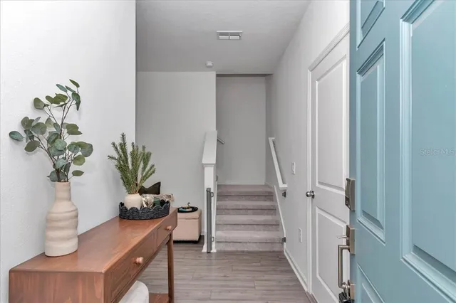 a view of entryway with wooden floor