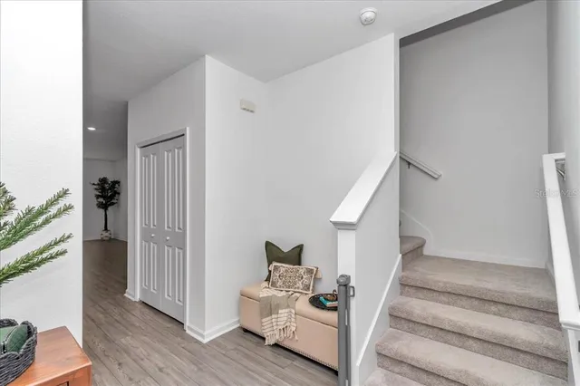 a kitchen with stainless steel appliances a refrigerator sink and microwave