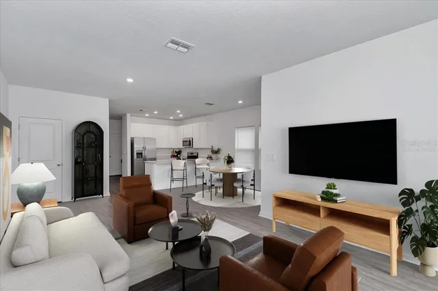 a view of a kitchen with wooden floor