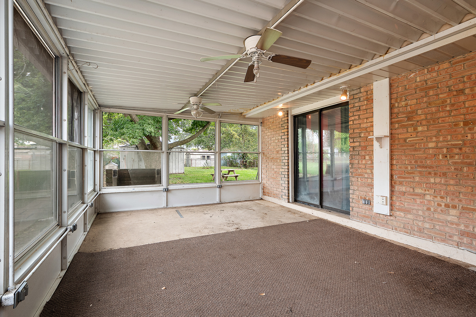3129 Butler Avenue Steger, IL 60475 - Photo 15 of 20 a view of an empty room with wooden floor and a sliding door