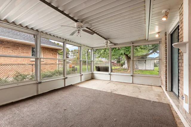 a view of an empty room with windows
