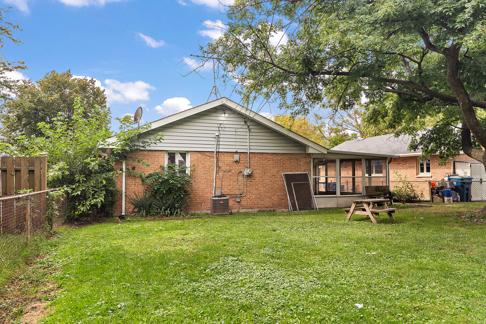 3129 Butler Avenue Steger, IL 60475 - Photo 18 of 20 a front view of a house with a garden and trees