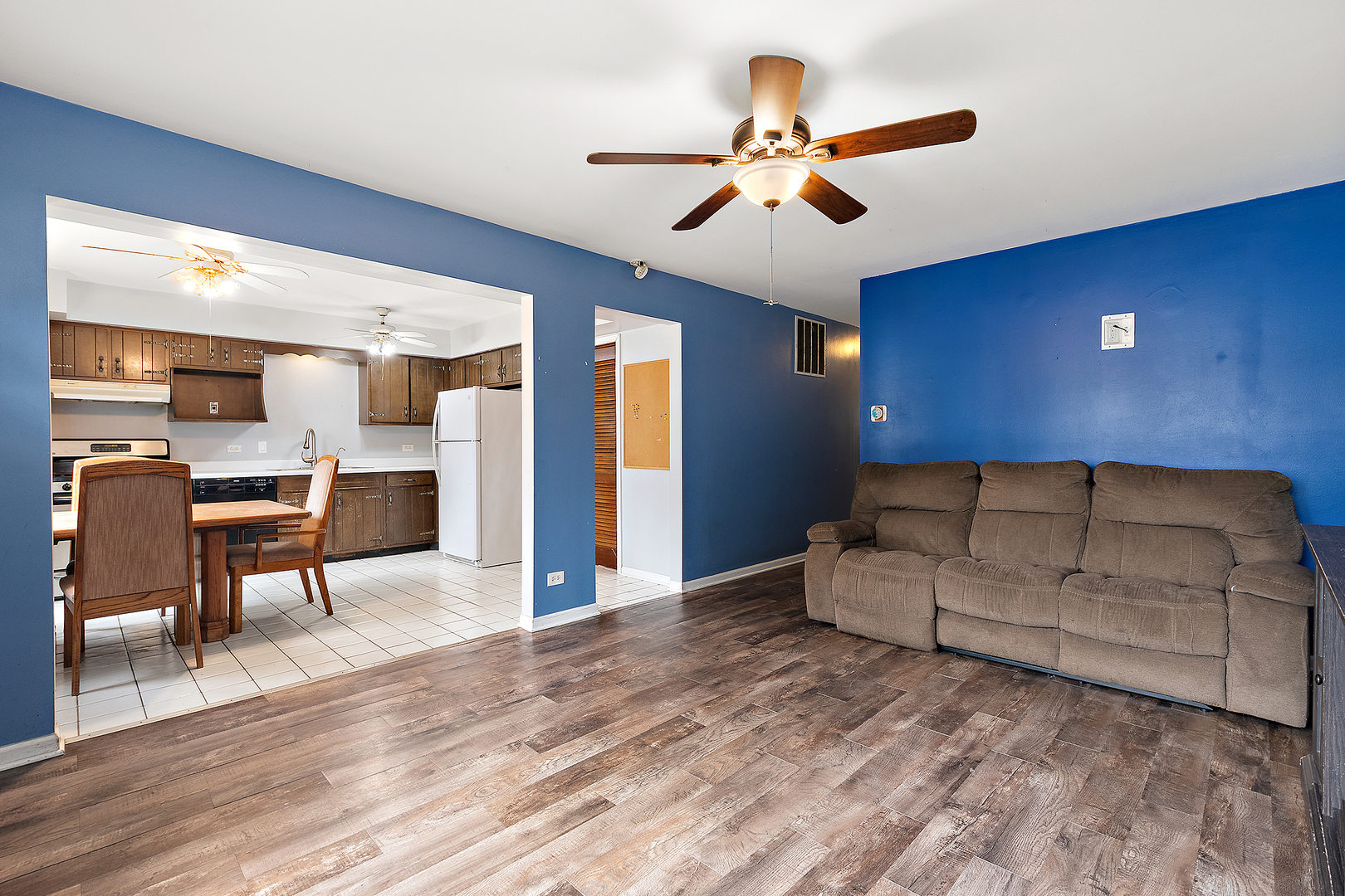 3129 Butler Avenue Steger, IL 60475 - Photo 3 of 20 a living room with a bed furniture and kitchen view