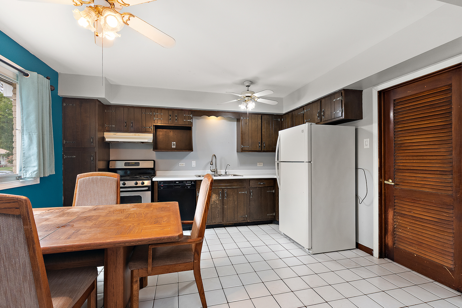 3129 Butler Avenue Steger, IL 60475 - Photo 8 of 20 a kitchen with stainless steel appliances kitchen island granite countertop a refrigerator a stove top oven a sink dishwasher and a refrigerator with wooden floor