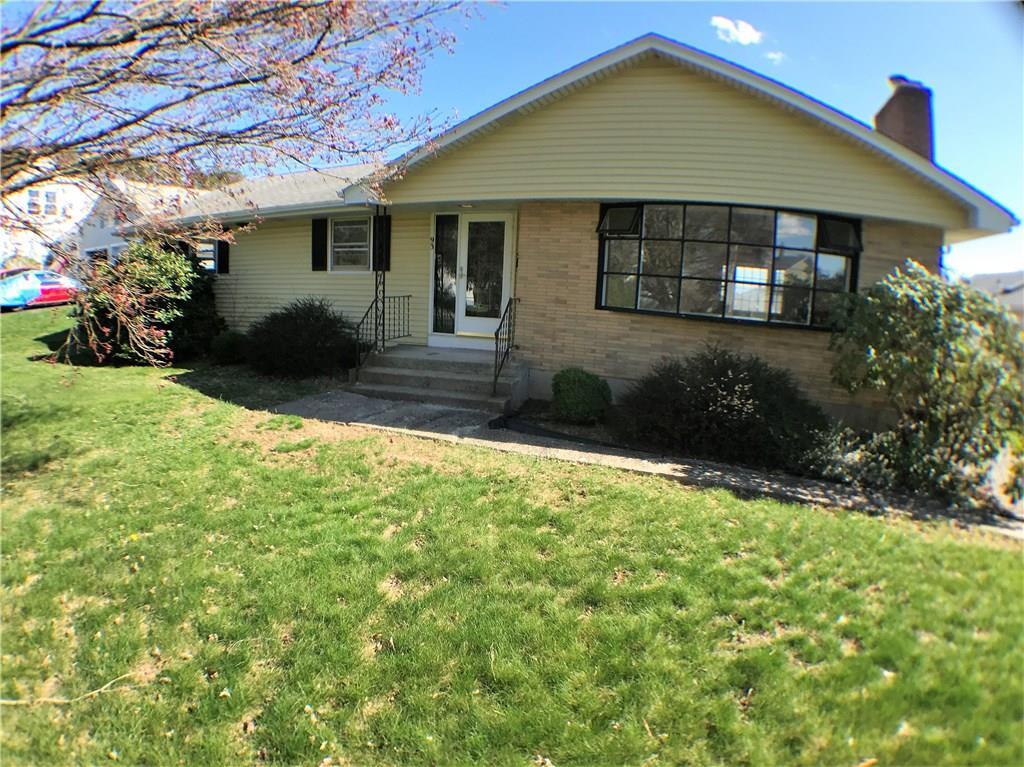 93 Blake Road New Britain, CT 06053 - Photo 1 of 1 a front view of a house with garden