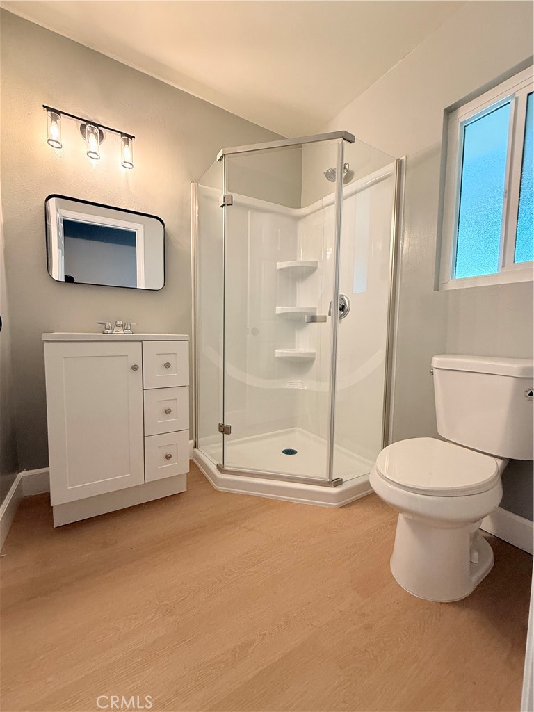 8803 Laurel Street Bellflower, CA 90706 - Photo 12 of 18 a bathroom with a toilet sink and shower