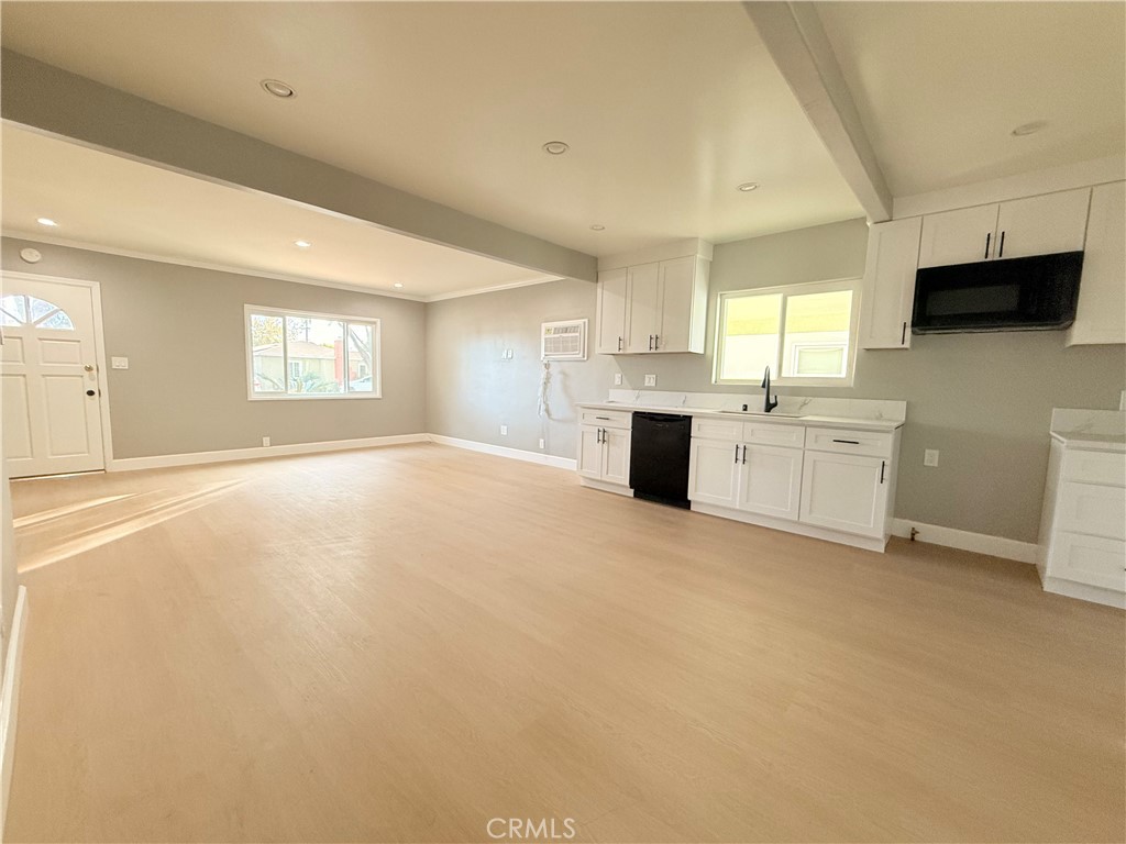 8803 Laurel Street Bellflower, CA 90706 - Photo 4 of 18 a large kitchen with a large window