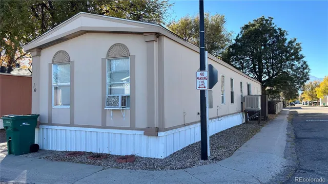 a view of a white house with a outdoor space