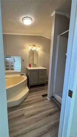 a bathroom with a glass shower door