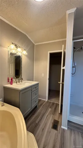 a bathroom with a double vanity sink and mirror