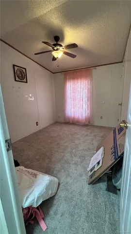 a bathroom with a granite countertop sink mirror vanity and toilet