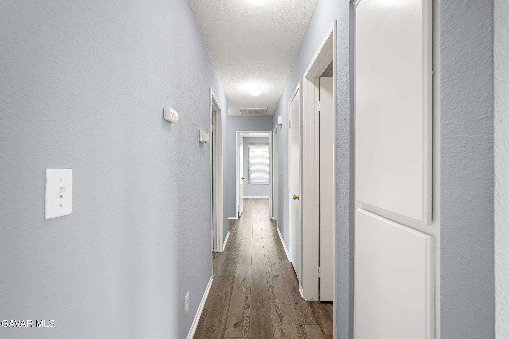 2108 Manchester Street Rosamond, CA 93560 - Photo 20 of 41 a view of hallway with wooden floor