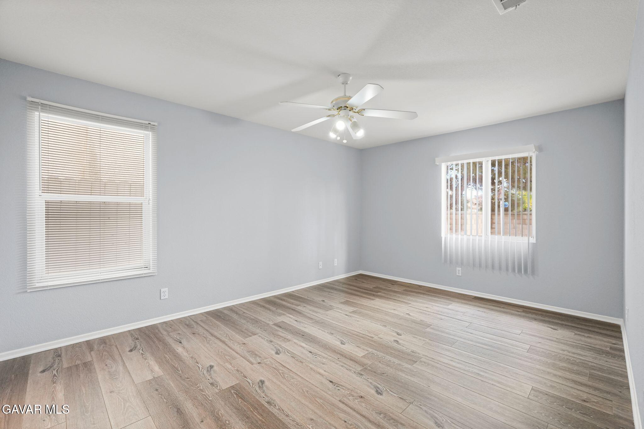 2108 Manchester Street Rosamond, CA 93560 - Photo 29 of 41 wooden floor in an empty room with a window
