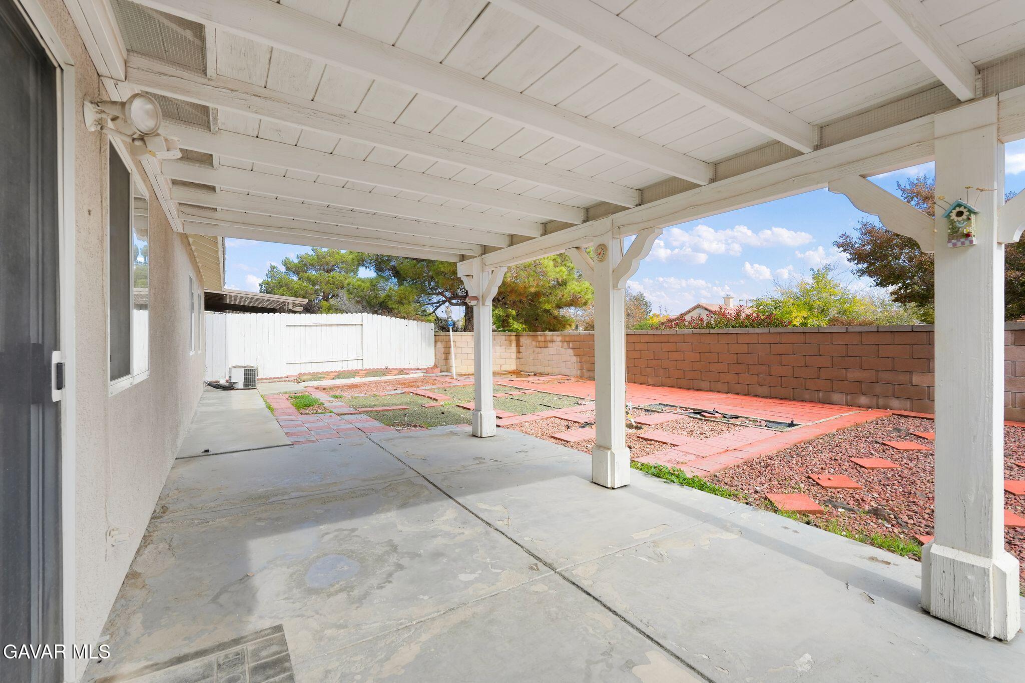 2108 Manchester Street Rosamond, CA 93560 - Photo 39 of 41 a view of a patio with a table and chairs