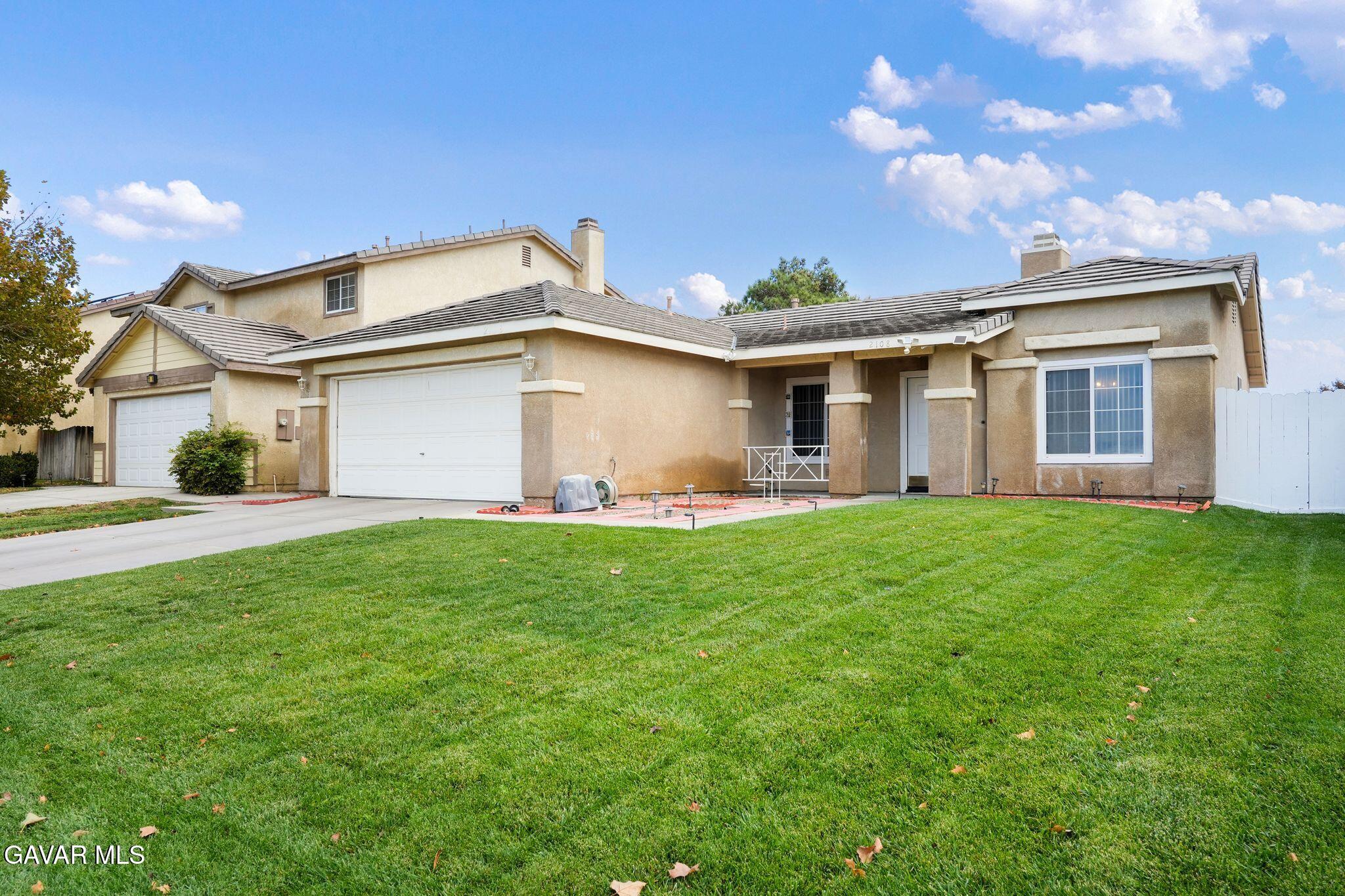 2108 Manchester Street Rosamond, CA 93560 - Photo 7 of 41 a front view of house with yard and green space